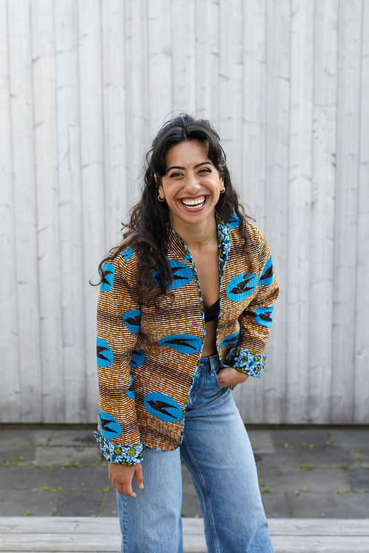 Omega Reversible Jacket in Tangerine Swallows